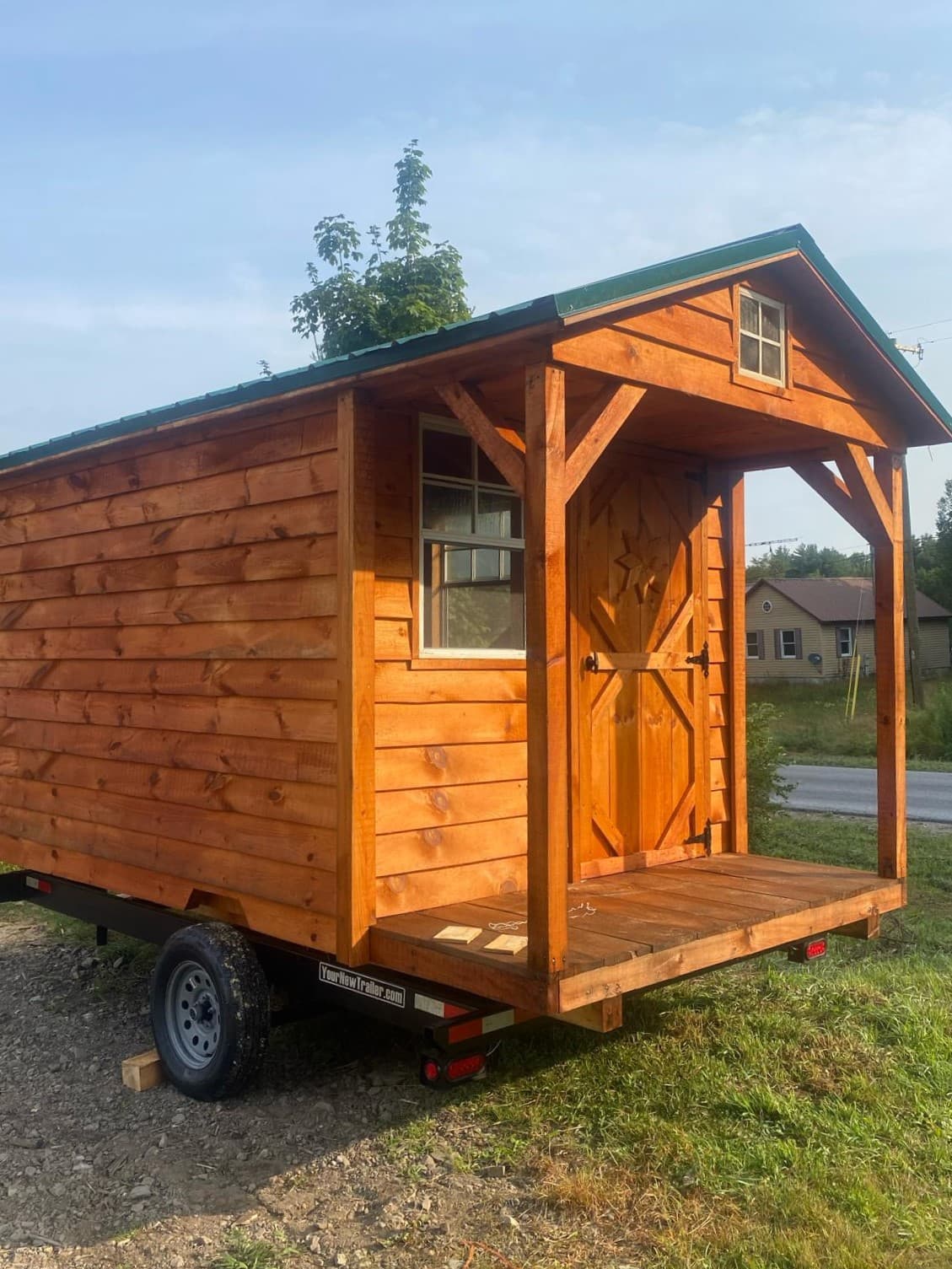 Picture of a wood tiny home on a trailer